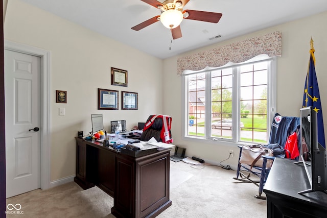 home office with ceiling fan, visible vents, light carpet, and baseboards
