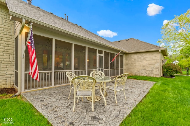 view of patio with outdoor dining area and a sunroom