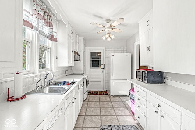 5747 Allisonville Rd, Indianapolis, IN 46220 - kitchen featuring white cabinets, a sink, light countertops, white appliances, and a ceiling fan