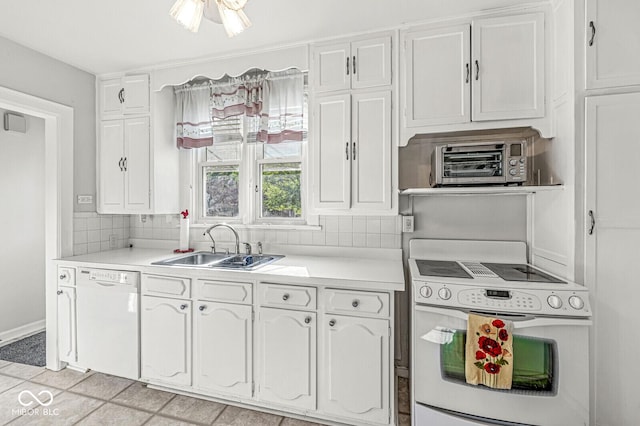 5747 Allisonville Rd, Indianapolis, IN 46220 - kitchen featuring a sink, white appliances, backsplash, light countertops, and white cabinets