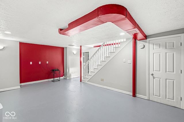 5747 Allisonville Rd, Indianapolis, IN 46220 - finished basement featuring a textured ceiling, stairway, and baseboards