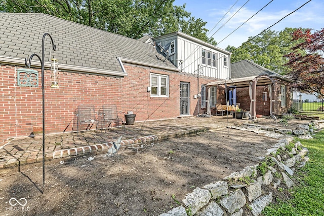 5747 Allisonville Rd, Indianapolis, IN 46220 - back of property featuring brick siding, fence, a gazebo, and a patio area