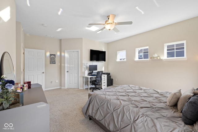 7067 Hart St, Cumberland, IN 46229 - carpeted bedroom featuring a desk, baseboards, and a ceiling fan