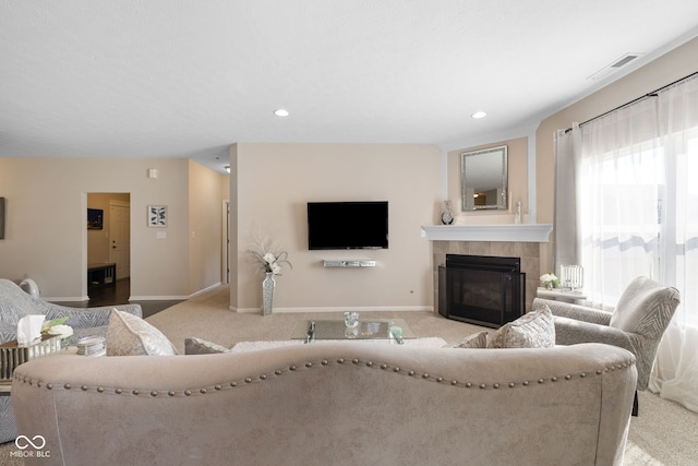 7067 Hart St, Cumberland, IN 46229 - living area featuring baseboards, carpet floors, a tile fireplace, and recessed lighting