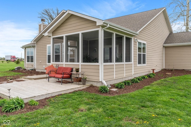 52 E 286th St, Atlanta, IN 46031 - rear view of property featuring a wooden deck, a yard, a sunroom, and a chimney