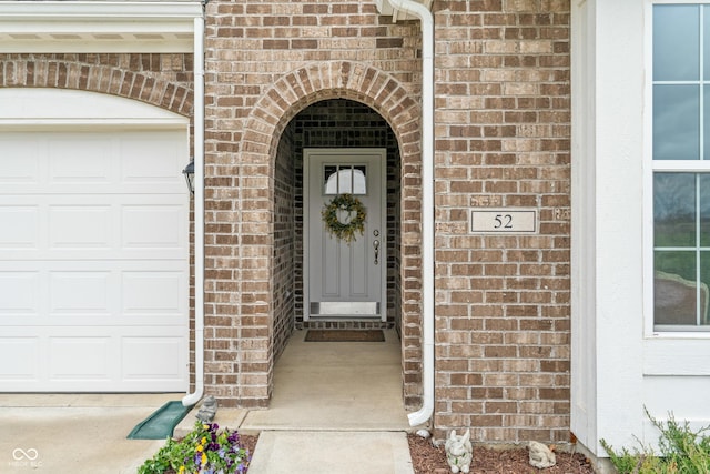 52 E 286th St, Atlanta, IN 46031 - property entrance featuring brick siding and an attached garage