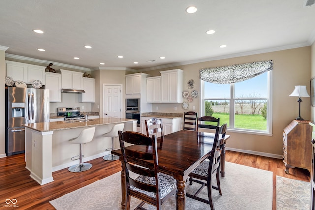 52 E 286th St, Atlanta, IN 46031 - dining area with baseboards, crown molding, wood finished floors, and recessed lighting