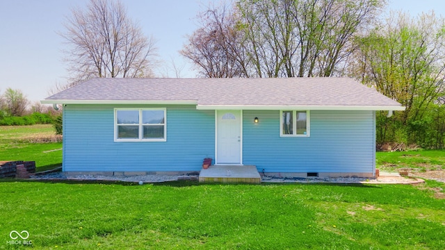 single story home with crawl space, roof with shingles, and a front lawn