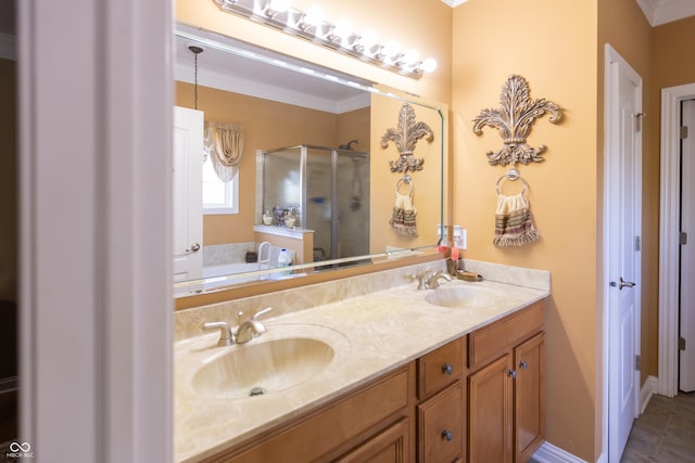 full bath featuring double vanity, crown molding, a stall shower, and a sink