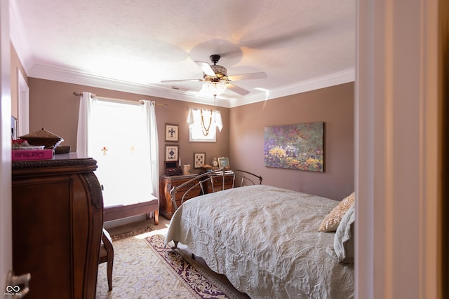 bedroom featuring ceiling fan and crown molding