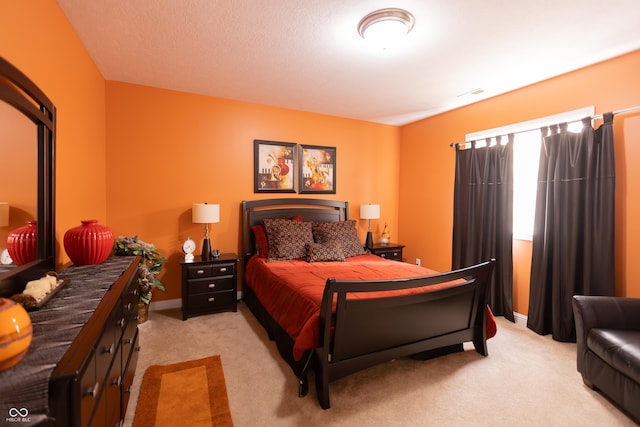 bedroom with light carpet
