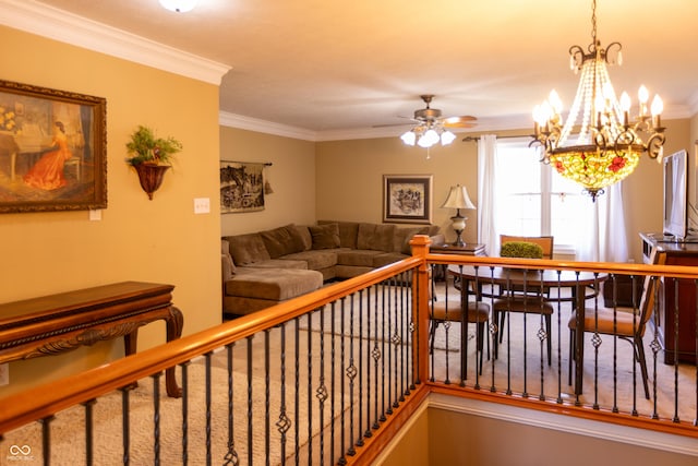 interior space with ceiling fan with notable chandelier and crown molding