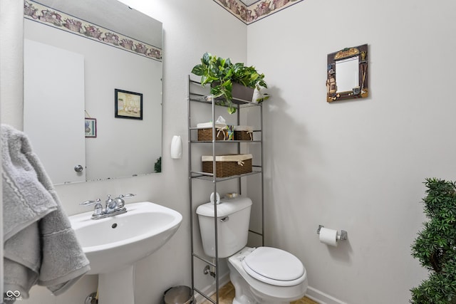 853 Westpointe Dr, Shelbyville, IN 46176 - bathroom with toilet, a sink, and baseboards