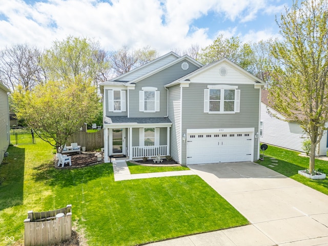 853 Westpointe Dr, Shelbyville, IN 46176 - traditional-style home featuring fence, concrete driveway, covered porch, a front yard, and a garage