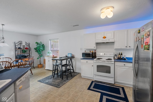 853 Westpointe Dr, Shelbyville, IN 46176 - kitchen featuring under cabinet range hood, visible vents, a textured ceiling, and appliances with stainless steel finishes