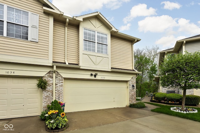 view of side of property featuring a garage