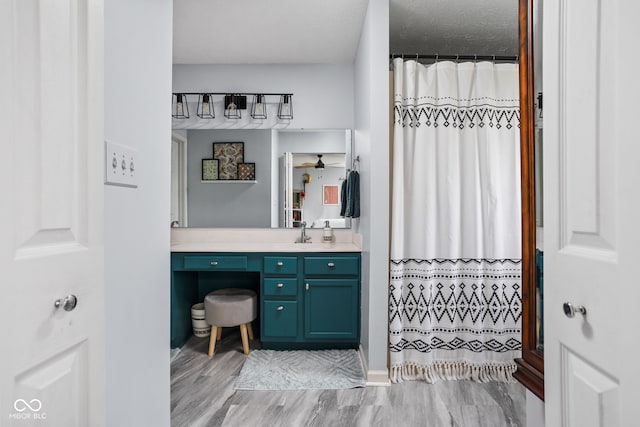 bathroom with a shower with curtain and vanity