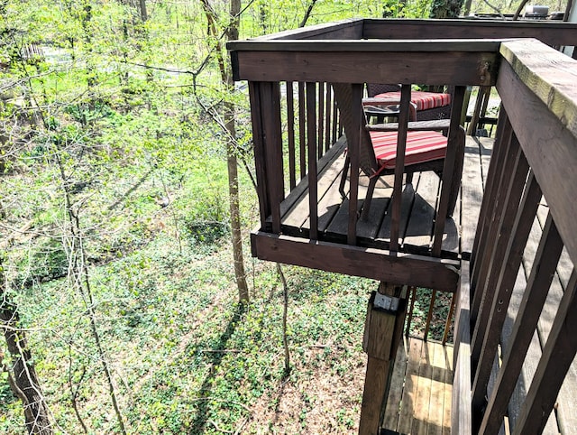 deck featuring a wooded view