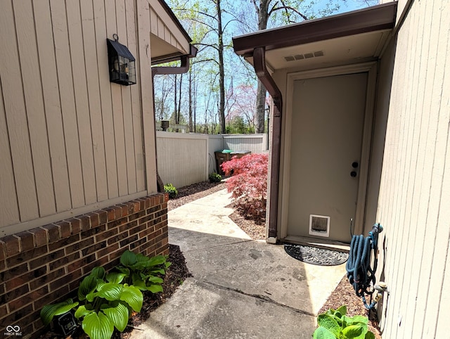 doorway to property with fence