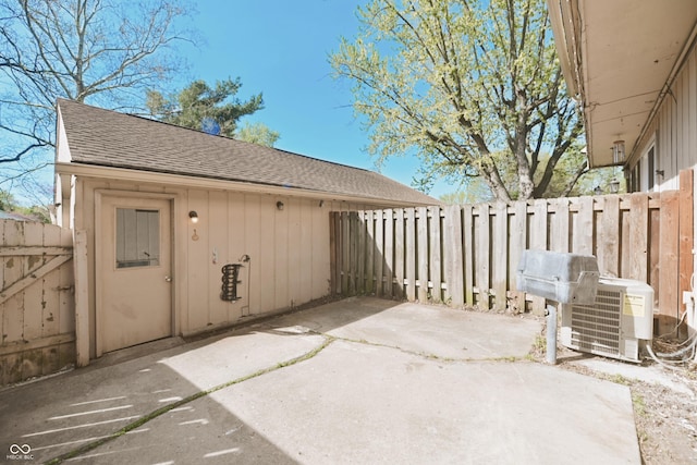 view of patio featuring central air condition unit and fence