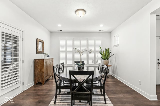 dining room featuring recessed lighting, baseboards, and dark wood-type flooring