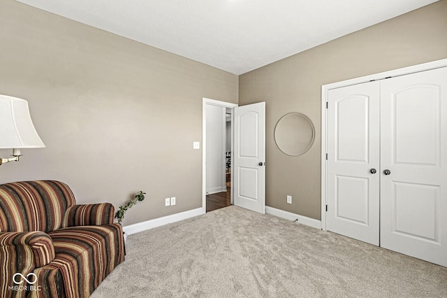 sitting room with carpet floors and baseboards