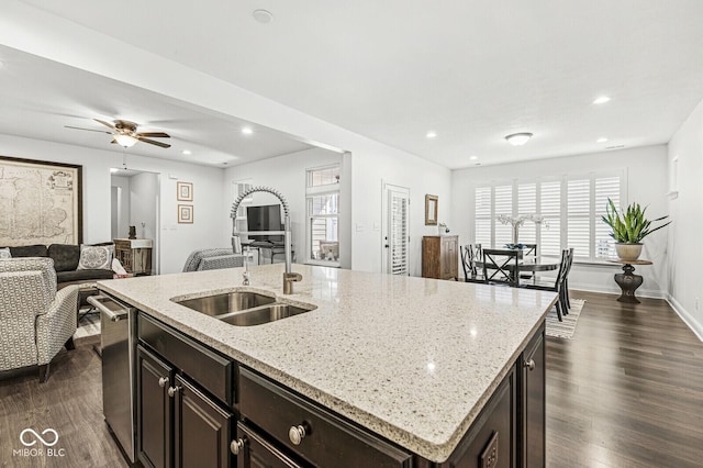 kitchen with dark wood-style flooring, open floor plan, a healthy amount of sunlight, and a sink