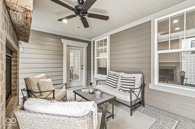 view of patio / terrace featuring ceiling fan and an outdoor living space