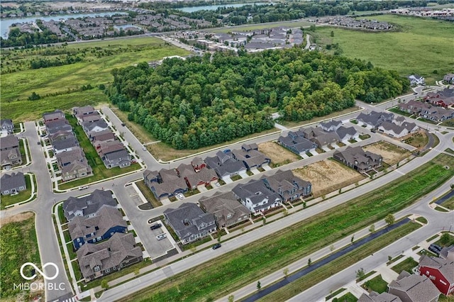 bird's eye view featuring a water view and a residential view
