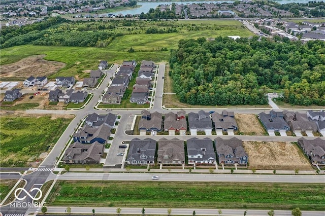 bird's eye view with a residential view and a water view