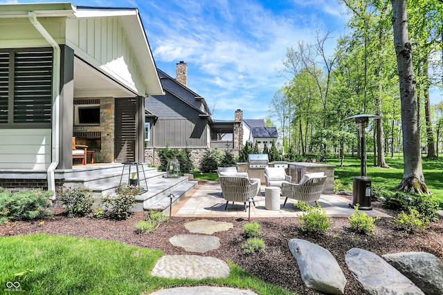 10725 Holliday Farms Blvd, Zionsville, IN 46077 - view of yard featuring a patio and an outdoor kitchen