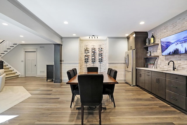 10725 Holliday Farms Blvd, Zionsville, IN 46077 - dining space with stairway, recessed lighting, light wood-style flooring, and ornamental molding