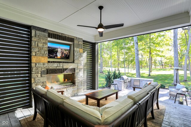 10725 Holliday Farms Blvd, Zionsville, IN 46077 - sunroom / solarium with an outdoor living space with a fireplace and a ceiling fan