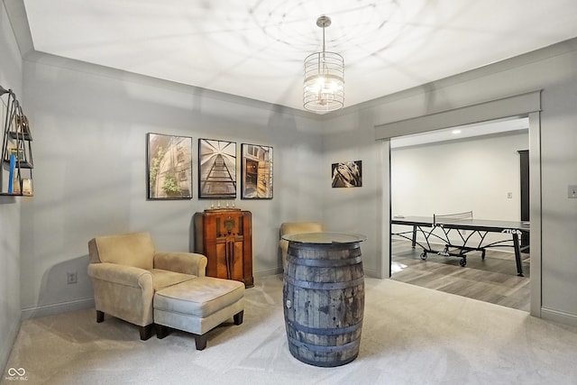 10725 Holliday Farms Blvd, Zionsville, IN 46077 - living area featuring carpet floors, baseboards, and a chandelier