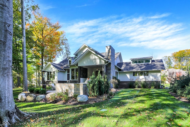 10725 Holliday Farms Blvd, Zionsville, IN 46077 - view of front facade featuring a front lawn, stone siding, board and batten siding, and a chimney