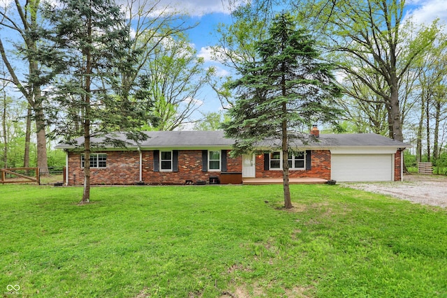 single story home with brick siding, fence, dirt driveway, an attached garage, and a front lawn