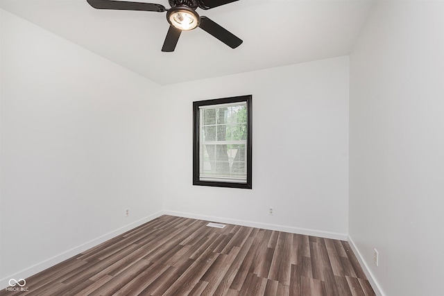 8041 Barry Rd, Indianapolis, IN 46219 - spare room with dark wood finished floors, baseboards, and a ceiling fan