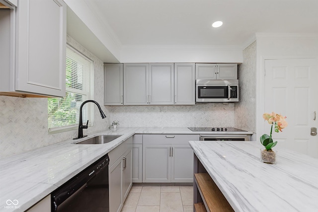 8041 Barry Rd, Indianapolis, IN 46219 - kitchen featuring black appliances, gray cabinetry, a sink, crown molding, and tasteful backsplash
