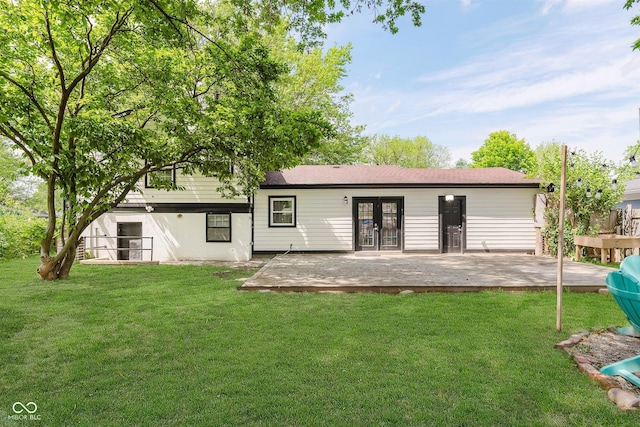 8041 Barry Rd, Indianapolis, IN 46219 - back of house featuring french doors, a yard, and a patio area