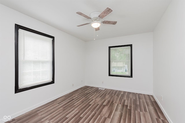 8041 Barry Rd, Indianapolis, IN 46219 - unfurnished room featuring wood finished floors, a ceiling fan, and baseboards