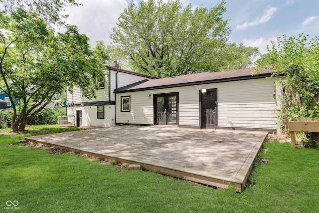 8041 Barry Rd, Indianapolis, IN 46219 - rear view of house with french doors, a deck, and a yard