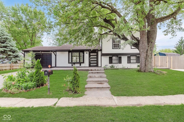8041 Barry Rd, Indianapolis, IN 46219 - split level home with an attached garage