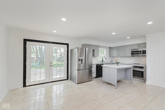 8041 Barry Rd, Indianapolis, IN 46219 - kitchen featuring appliances with stainless steel finishes, gray cabinets, light countertops, backsplash, and french doors