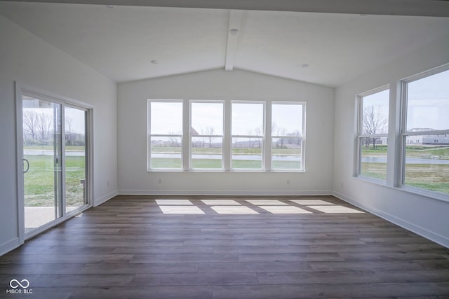 unfurnished sunroom with a wealth of natural light and beamed ceiling
