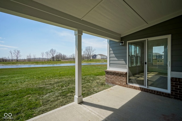 view of patio with a water view