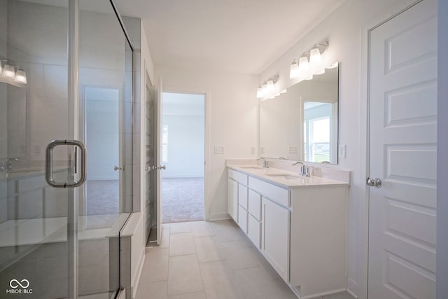 full bathroom featuring tile patterned floors, a sink, double vanity, and a stall shower