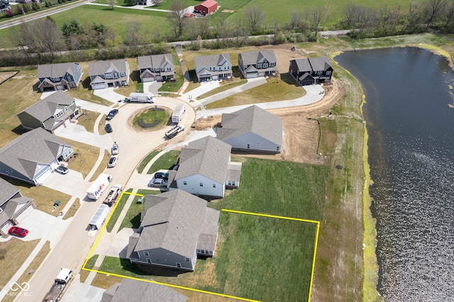 bird's eye view with a residential view and a water view