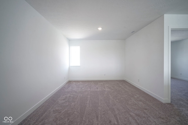 additional living space featuring carpet and baseboards