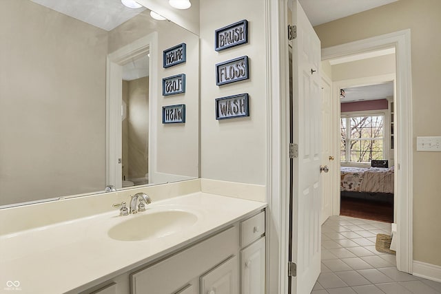 bathroom with tile patterned floors, ensuite bathroom, vanity, and toilet