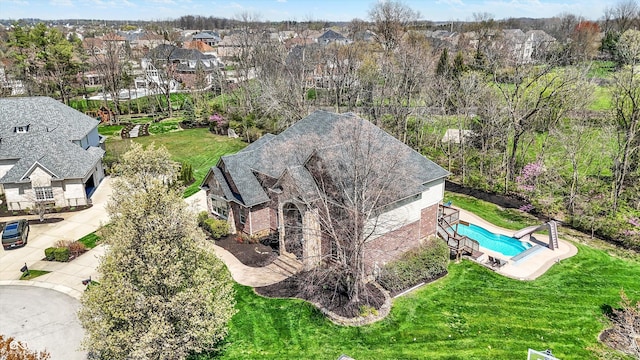 birds eye view of property with a residential view